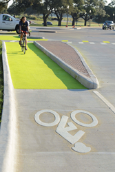 Student rides bike through Dutch Junction